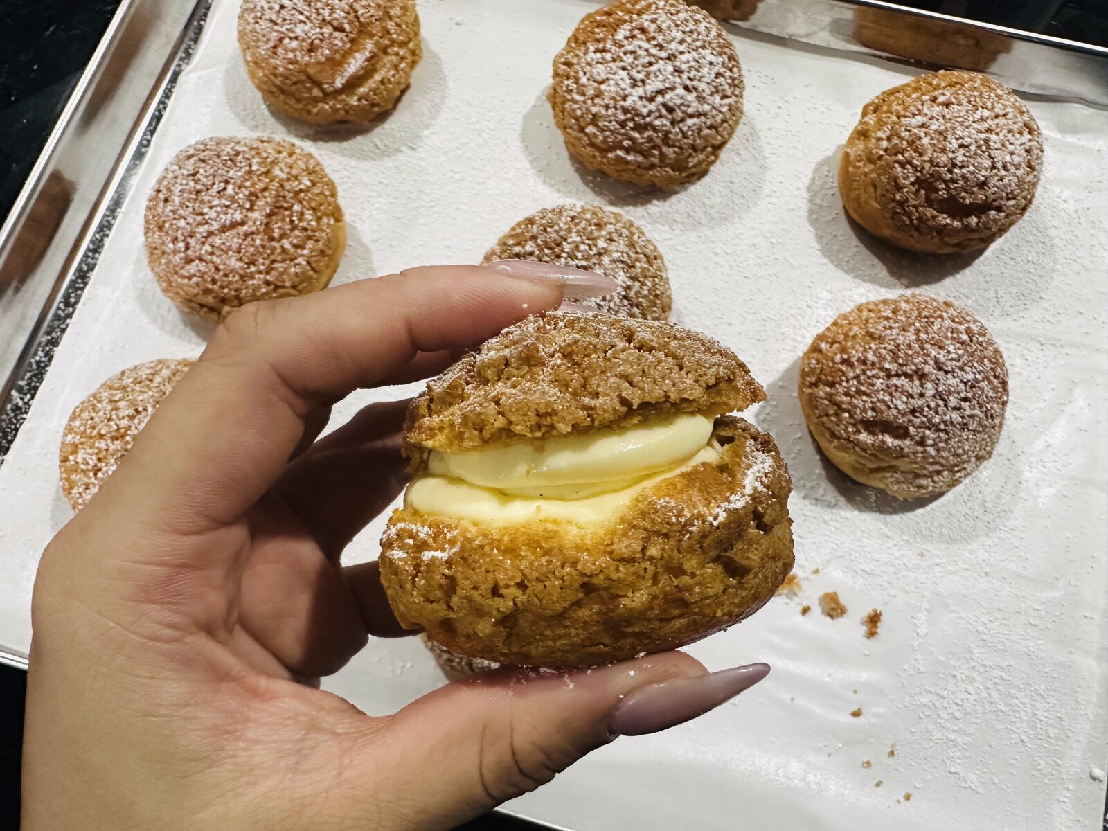 Choux pastry held up to show texture