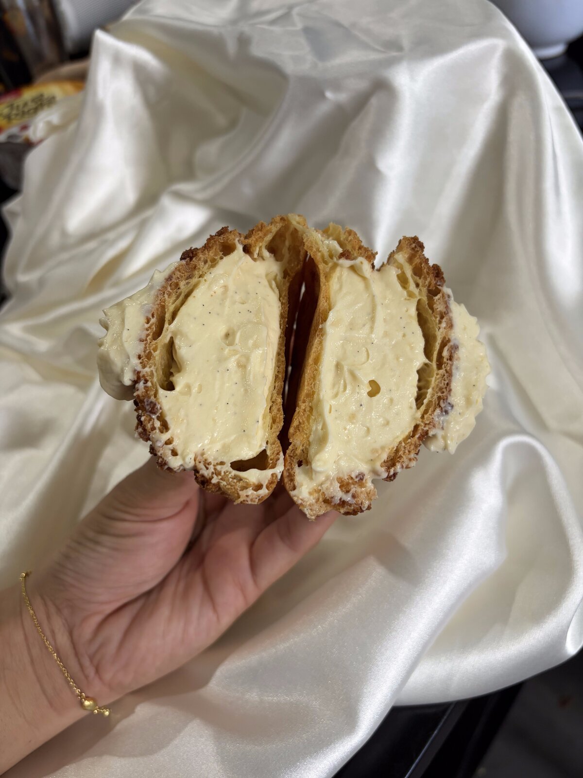 Crumble n Bloom choux pastry, cut open to show the cream filling